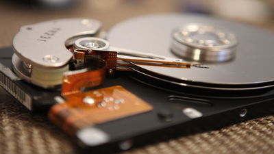 A photograph of the internals of a slim hard drive.