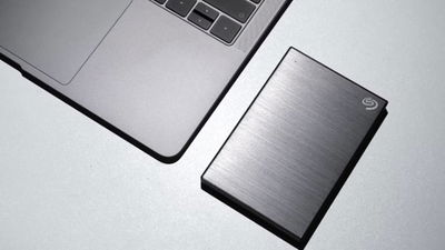 External hard drive next to laptop.