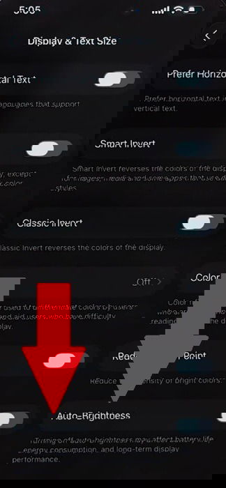 Turning on Auto-Brightness on iPhone.