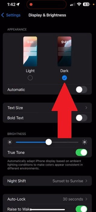 Enable dark mode on iPhone.