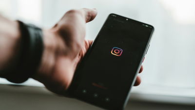 A person accessing the Instagram app from their smartphone