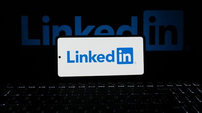 Linkedin a laptop and a phone.