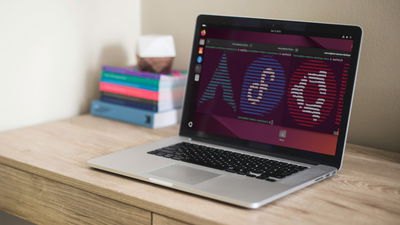 A photograph of a laptop on top of a table.