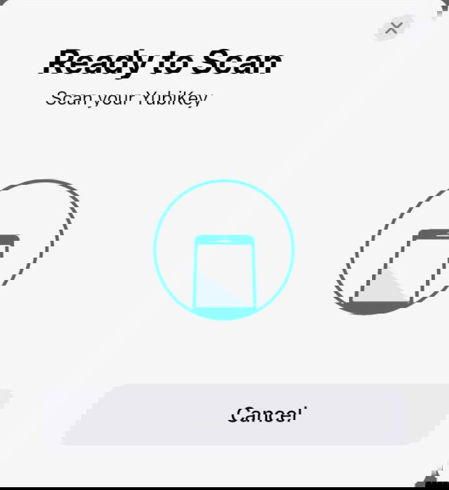 A screenshot showing the NFC scan prompt for a Yubikey in iOS.