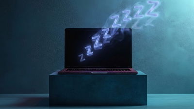 A laptop on sleep in dark elevated area with sleep visuals on it