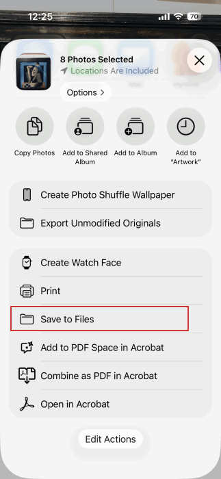 Selecting "Save to Files" on group of photos on iPhone.
