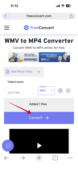 Pressing "Convert" button in FreeConvert web tool to begin WMV file conversion on iPhone. 