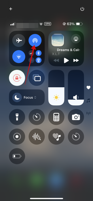 Tapping on the AirDrop icon in iPhone Control Center. 
